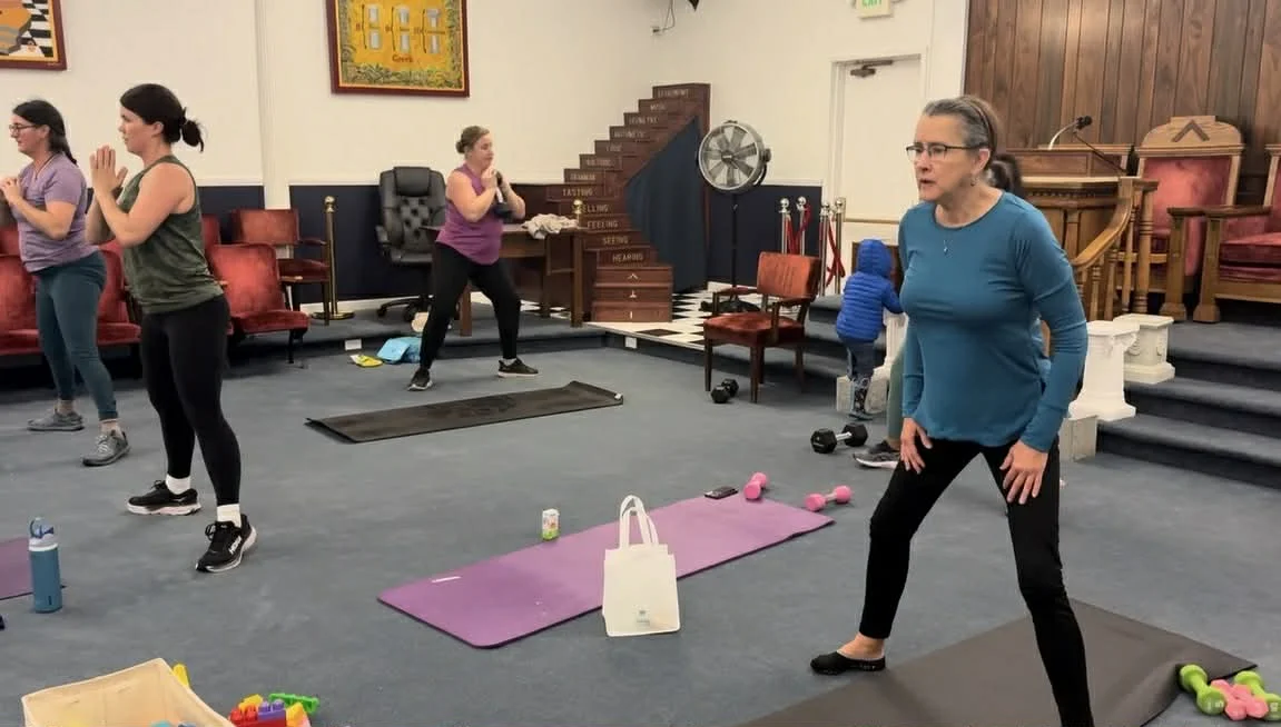 Class members of various ages working out together